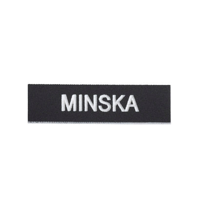 Skylt Minska (Rexel)